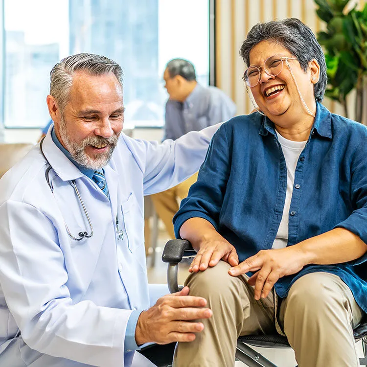 OMD doctor celebrating outcomes with patient web