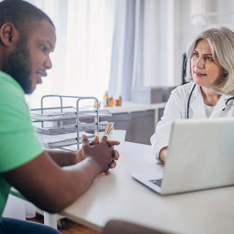 OMD doctor reviewing progress with patient web