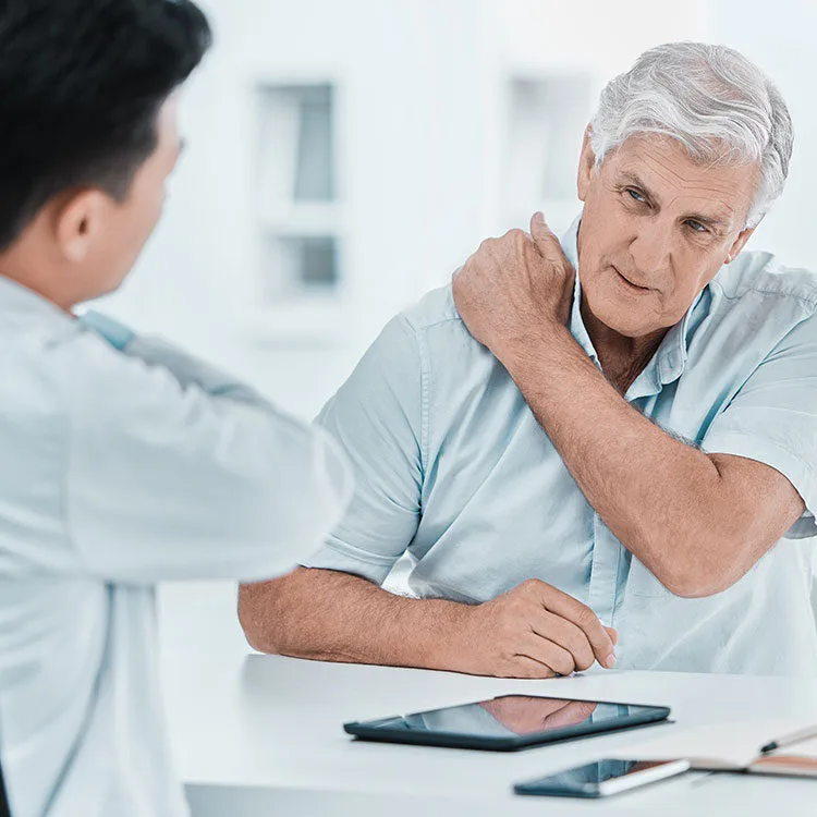 OMD patient describing chronic pain to doctor web