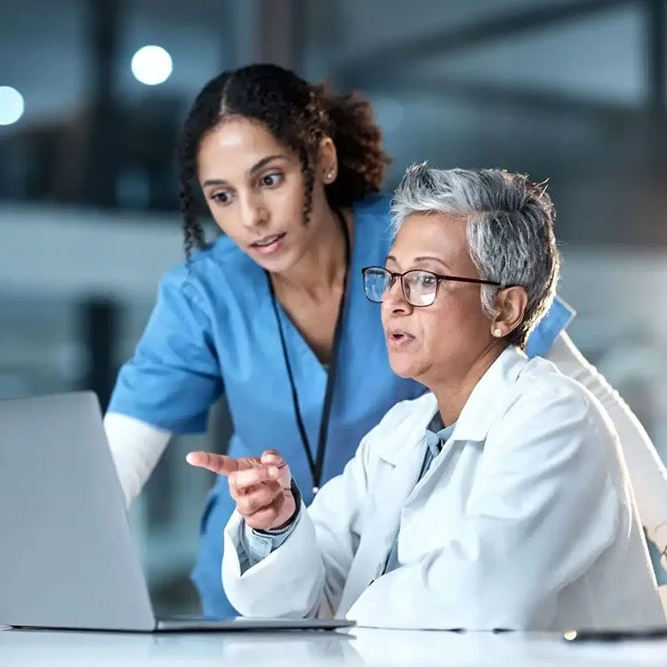 Doctor and nurse in night healthcare planning research web