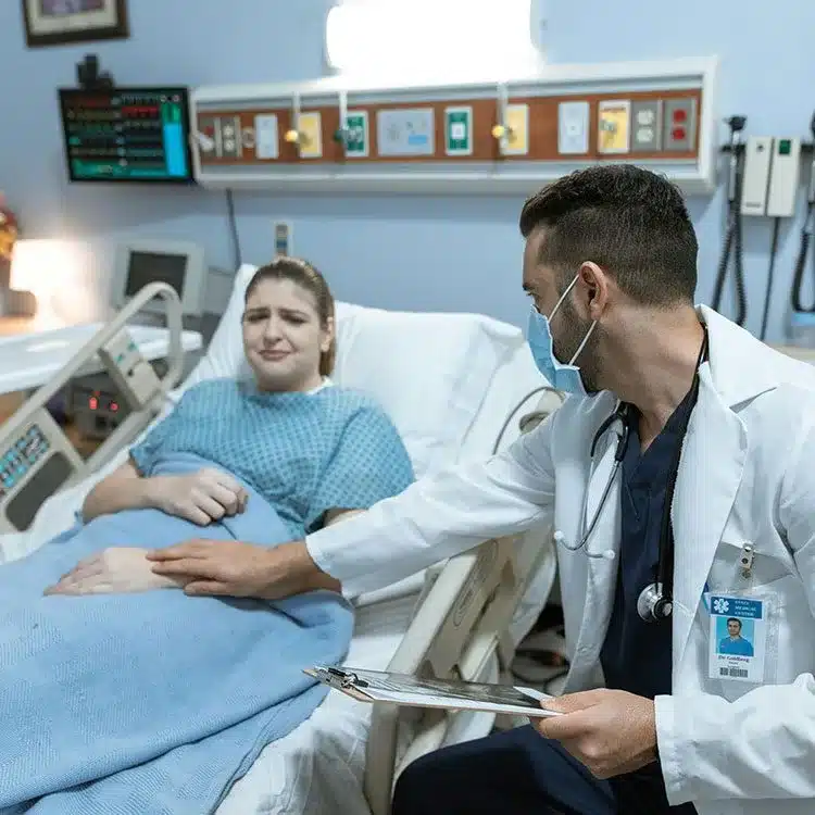 Doctor consults crying patient web