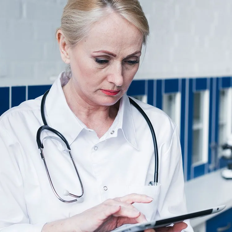 Doctor with stethoscope and tablet web