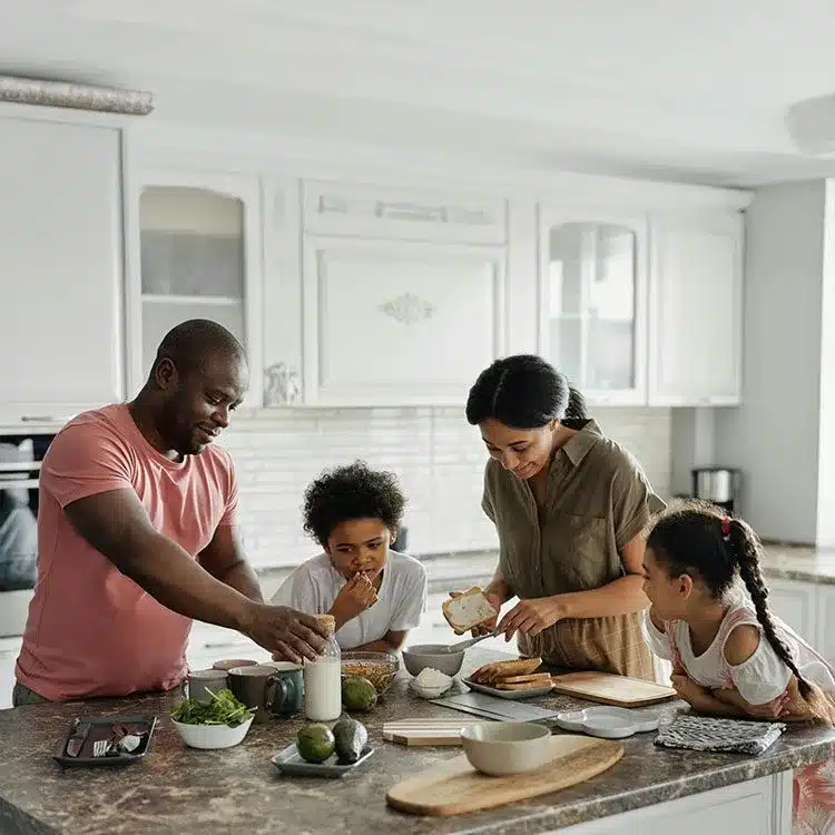Family making breakfast in the kitchen web