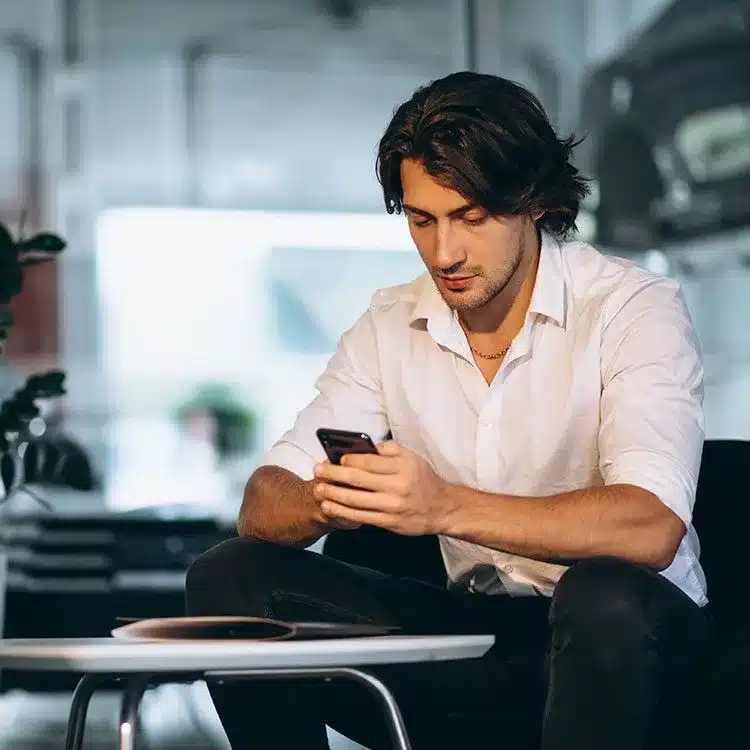 Handsome business man car showroom web