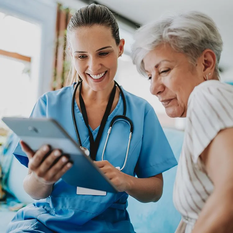 Home care healthcare professional using tablet web