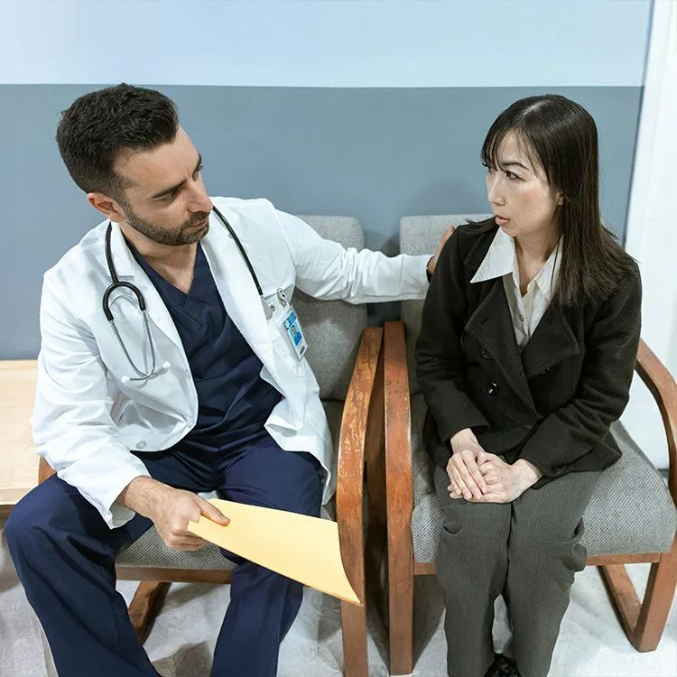 Male doctor consoles a patient web