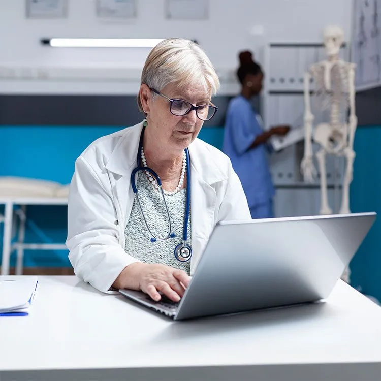 Medic working with computer technology for treatment and analysis web