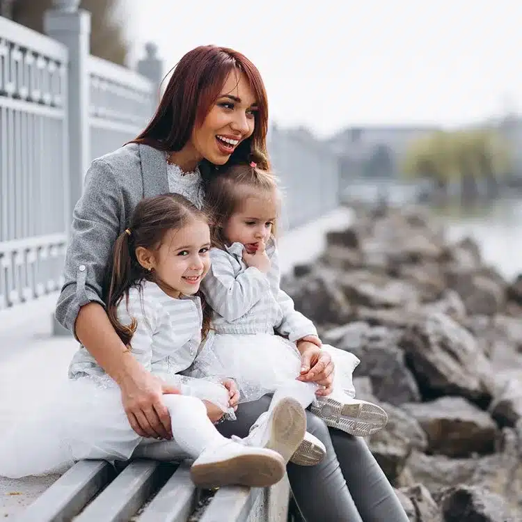 Mother with two daughters web