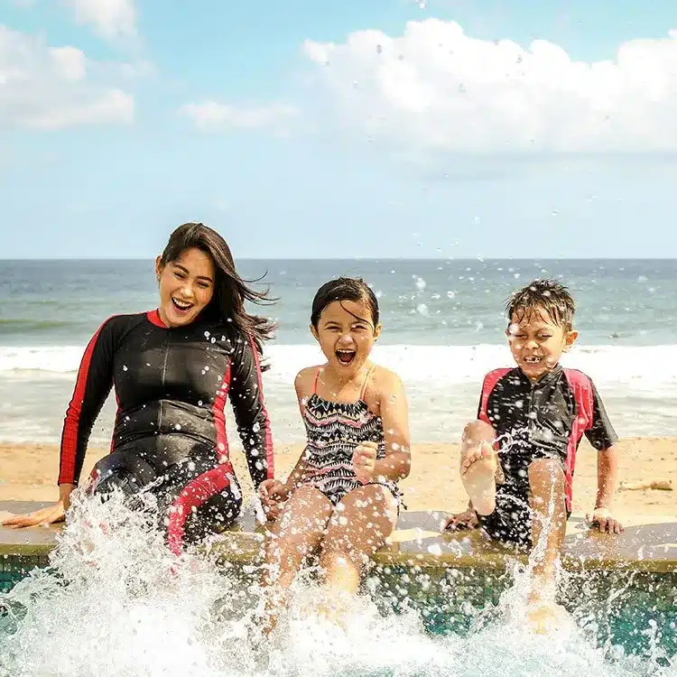 Mother enjoying life with three children web