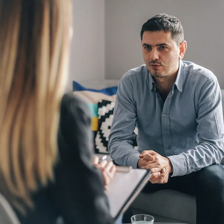 Young man having a meeting with counselor web